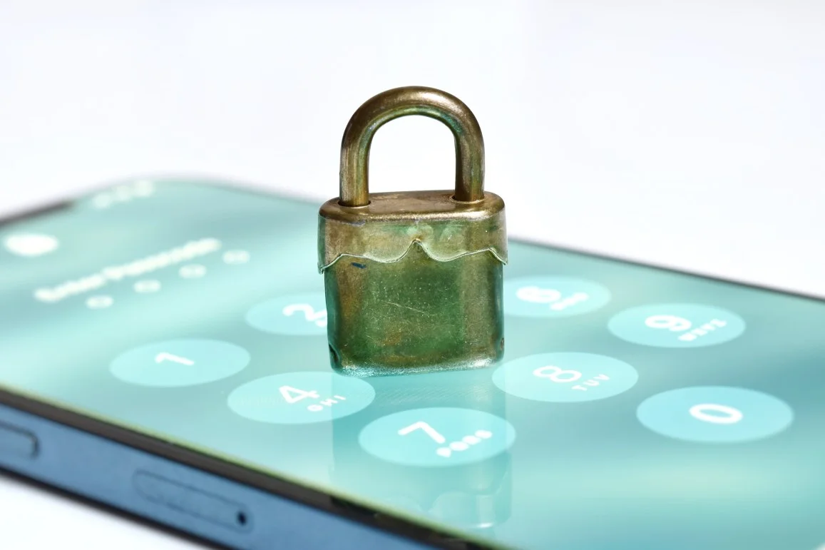 Security concept with padlock over a mobile phone 