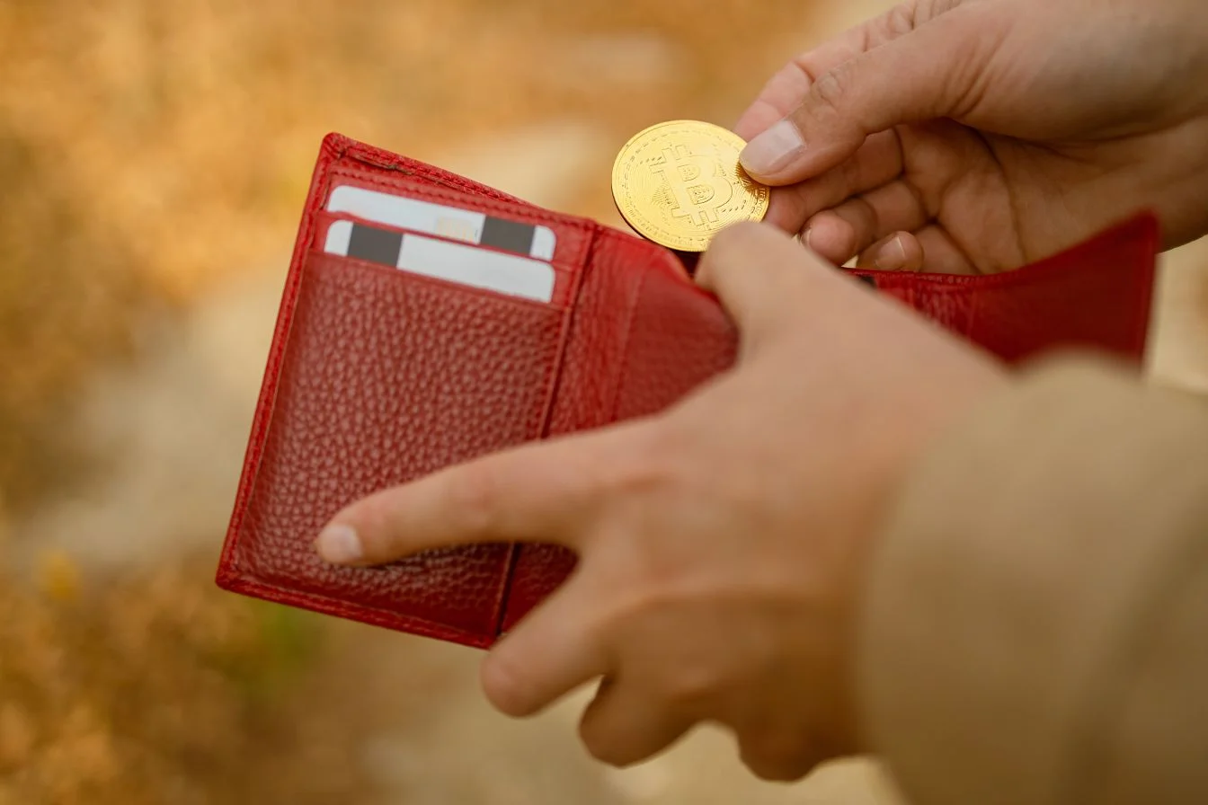  Woman holding in hands wallet with bitcoin cash coin 